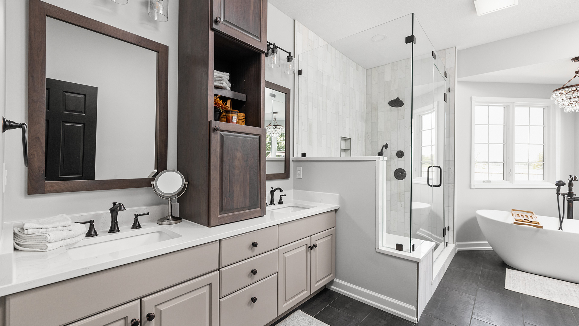 luxury bathroom remodel with double vanity, glass walk-in shower, and freestanding tub by Gannon and Company